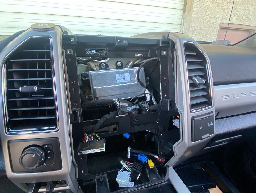 The dashboard of a ford super duty truck has been removed