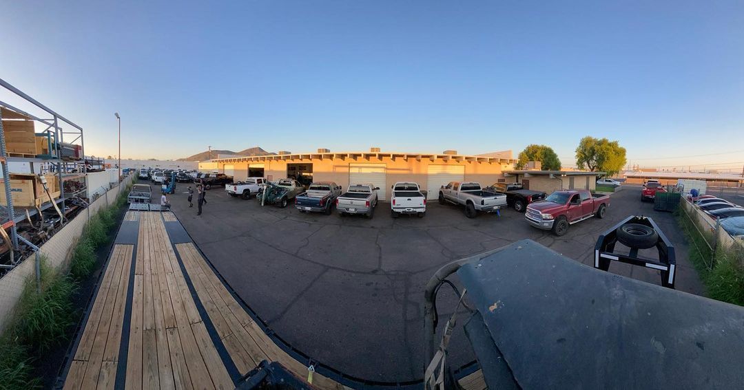 A lot of cars are parked in a parking lot.