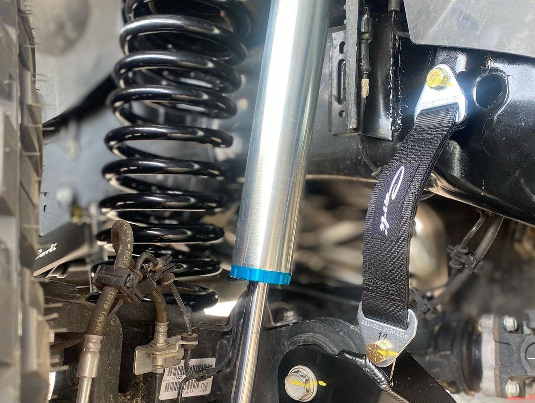 A close up of a shock absorber on a vehicle