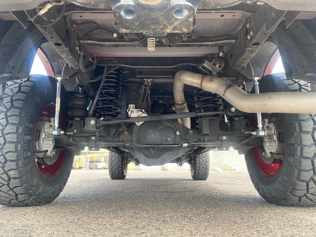 A close up of the underside of a truck.