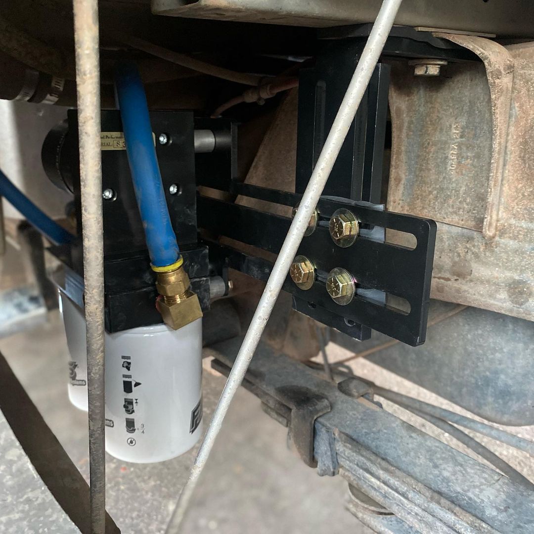 A close up of a fuel filter on a vehicle