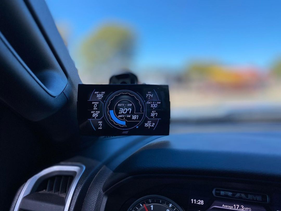 A close up of a car dashboard with a digital display on it.