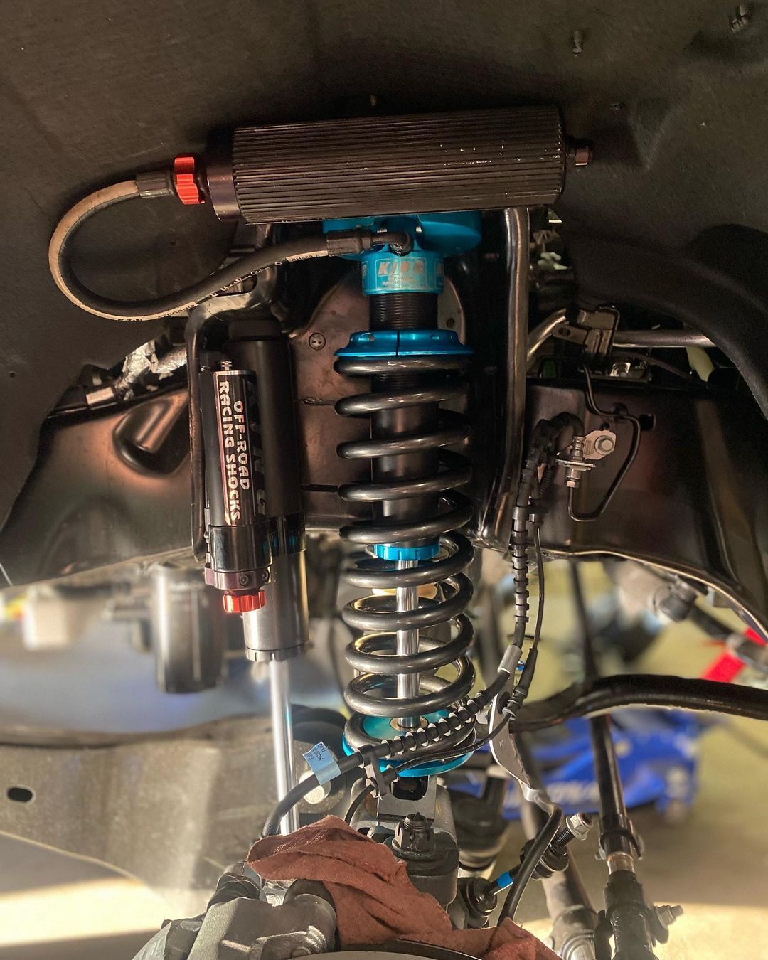 A close up of a suspension system on a car.