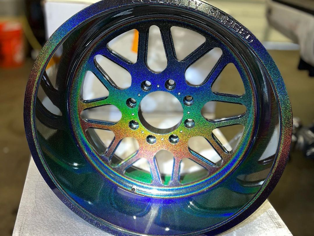 A close up of a rainbow colored wheel on a table.