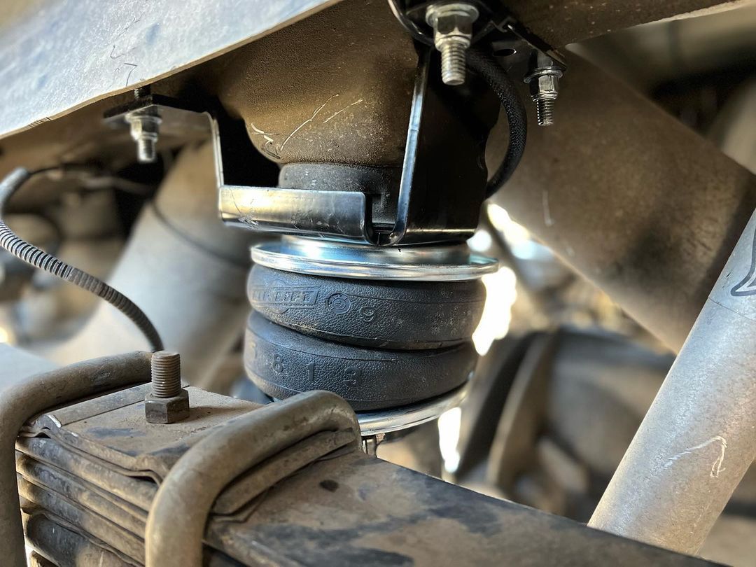 A close up of a shock absorber on a car