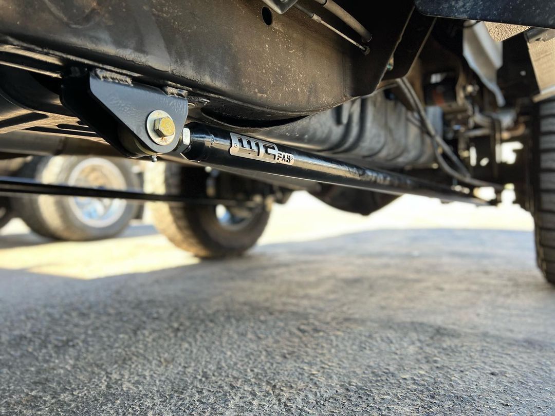 A close up of the underside of a truck 's suspension system