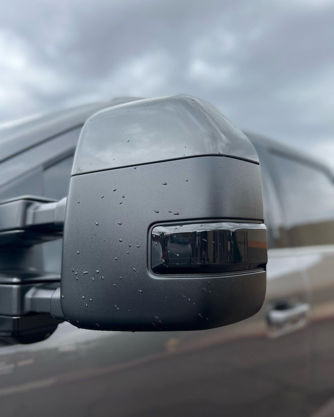 A close up of a side view mirror on a car