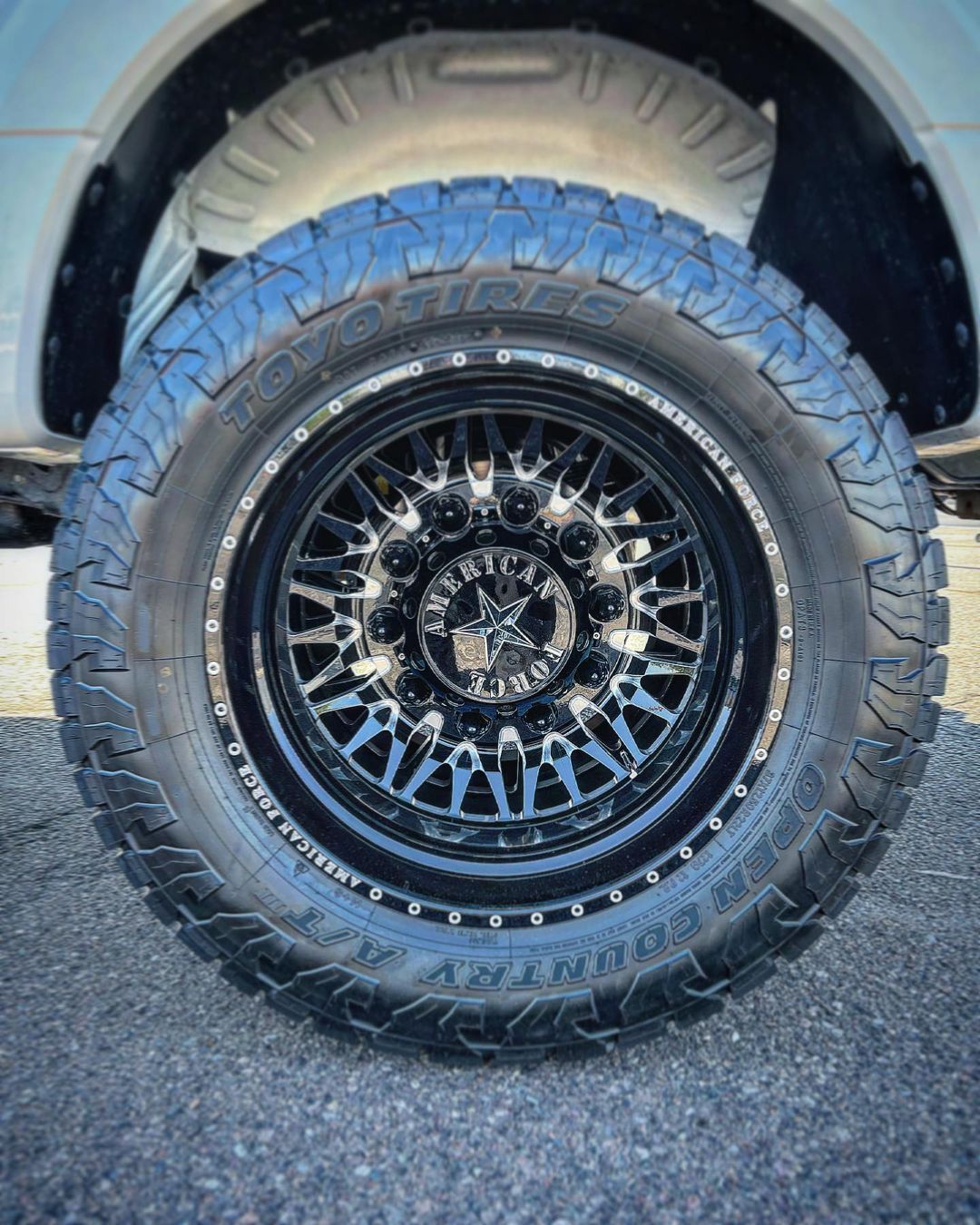A close up of a tire and wheel on a truck.