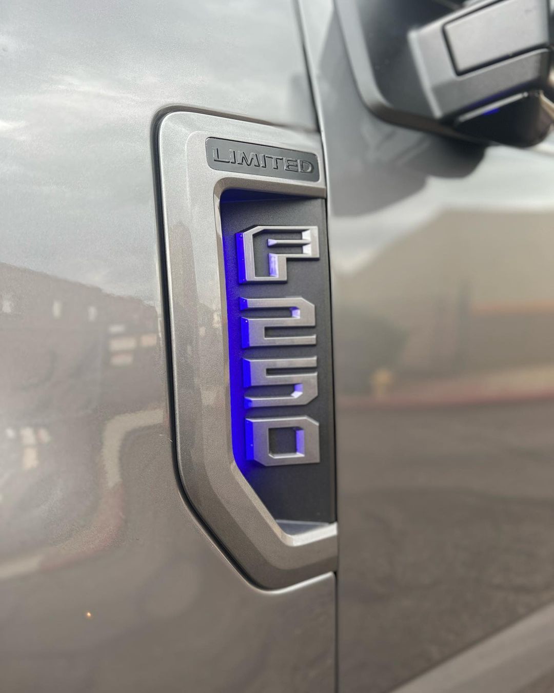 A close up of the side of a ford truck