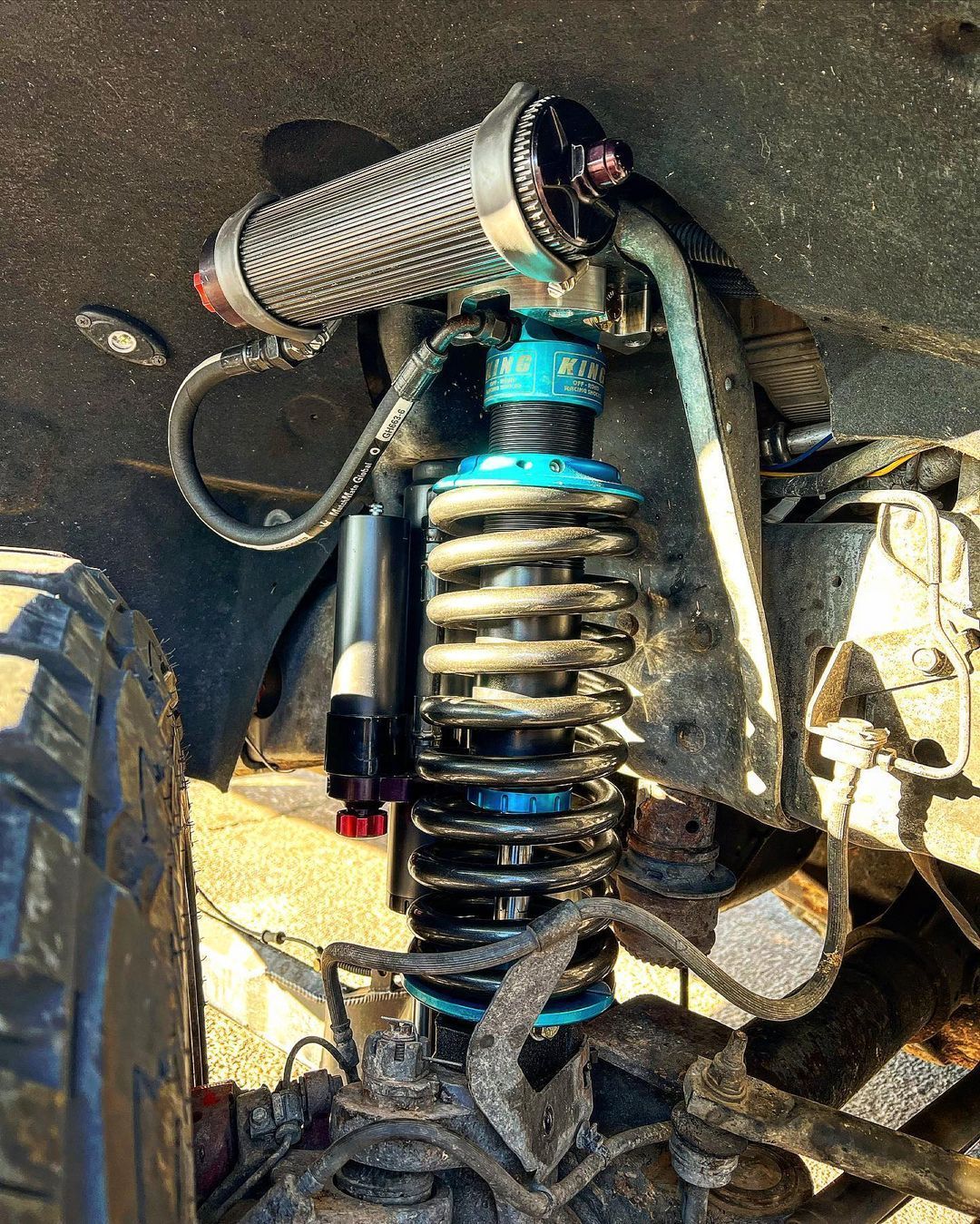 A close up of a shock absorber on a vehicle
