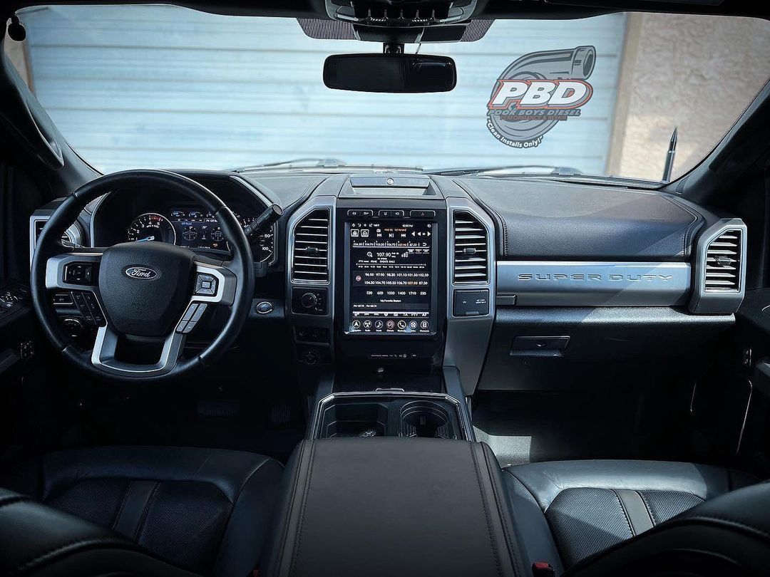 The interior of a ford truck with a pbd logo on the door