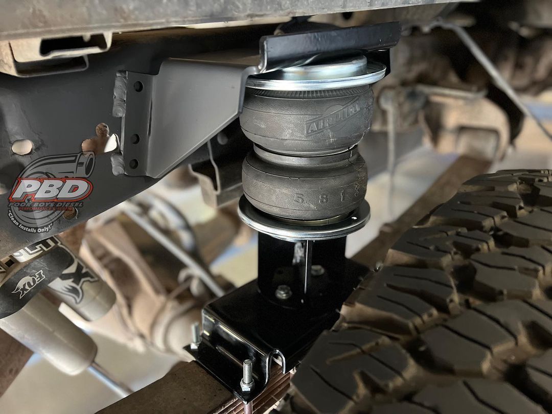 A close up of a suspension system on a truck