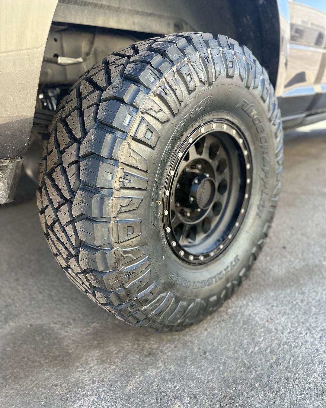A close up of a tire on a truck.