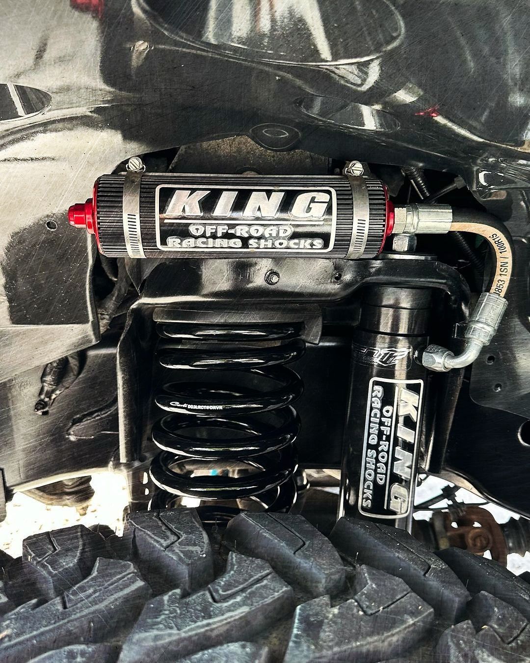 A close up of a king off road suspension system