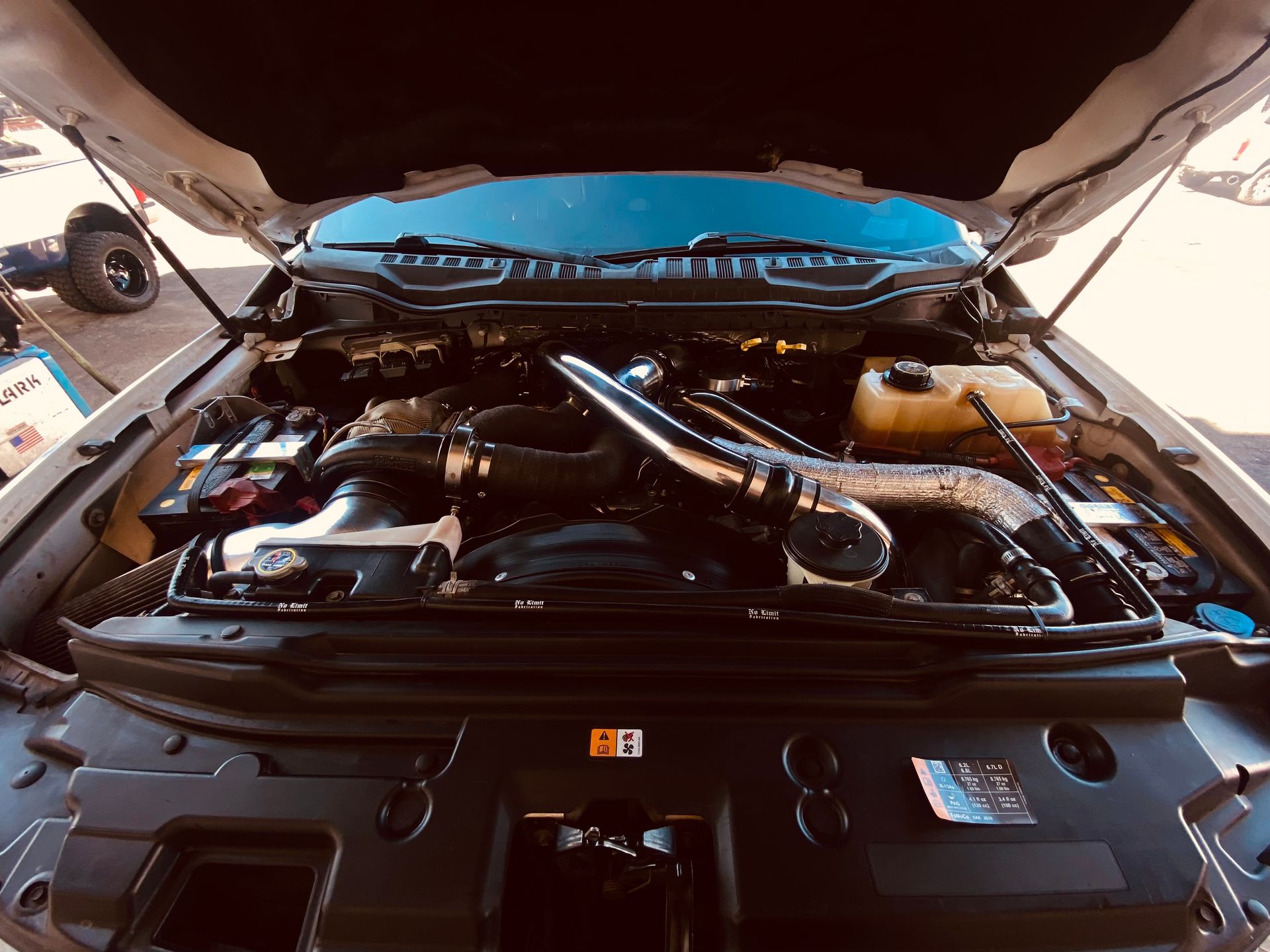 The engine of a car is shown with the hood open.