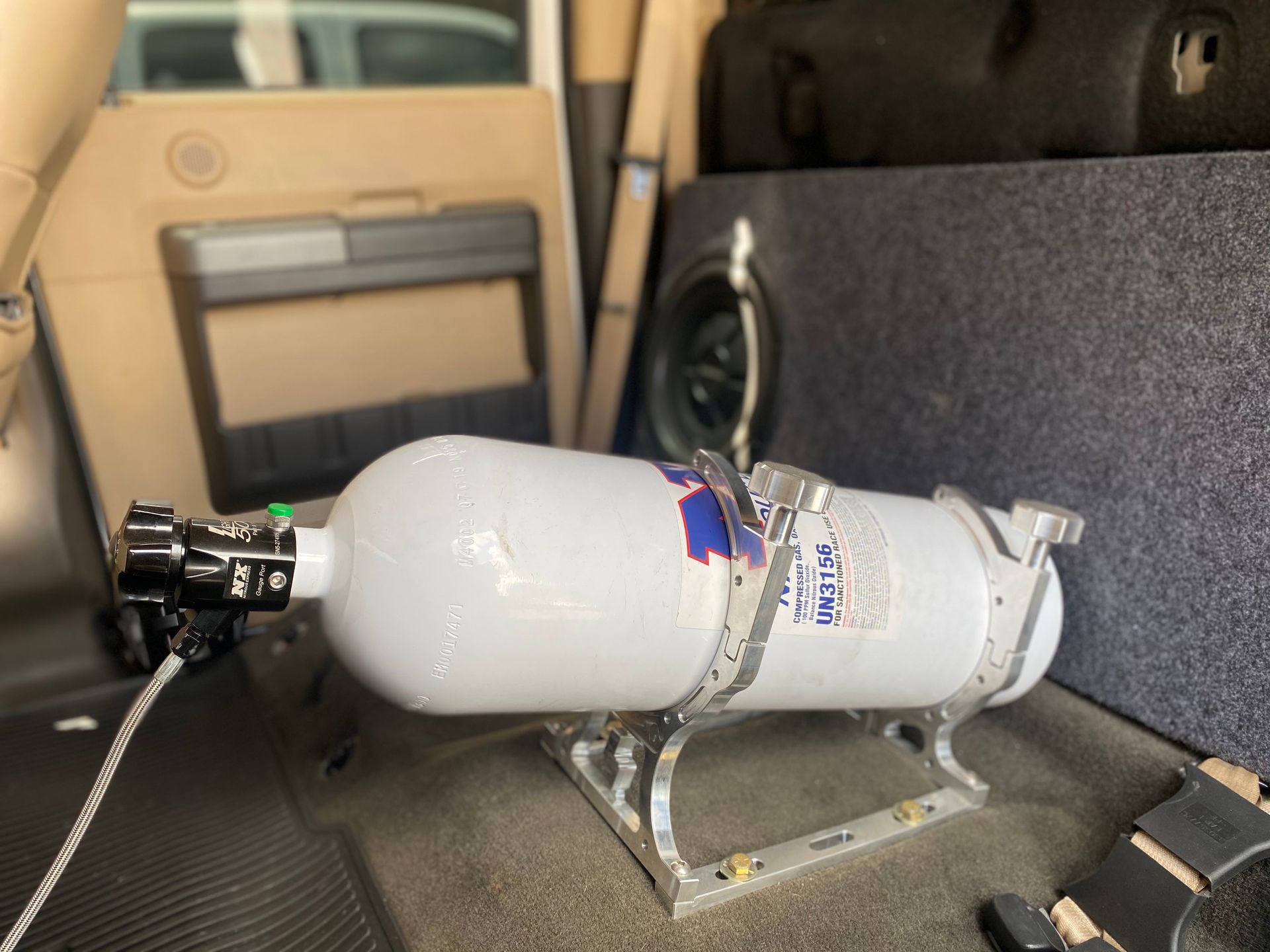 A scuba tank is sitting in the back of a car