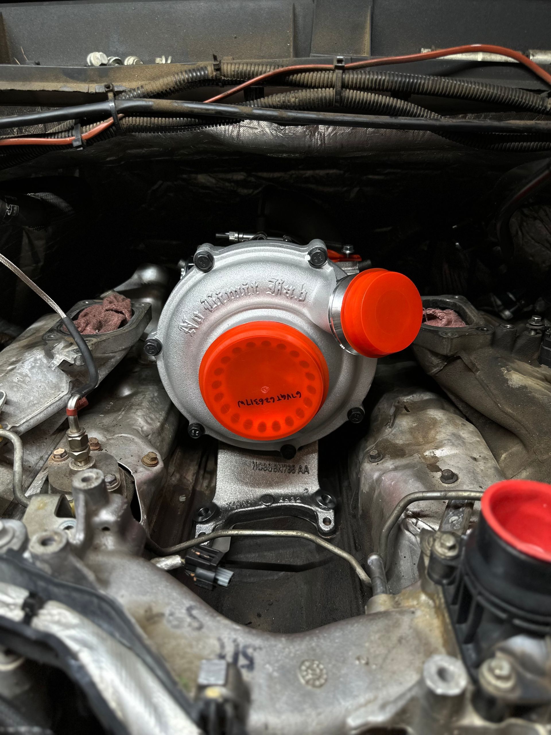 A close up of a turbocharger in a car engine