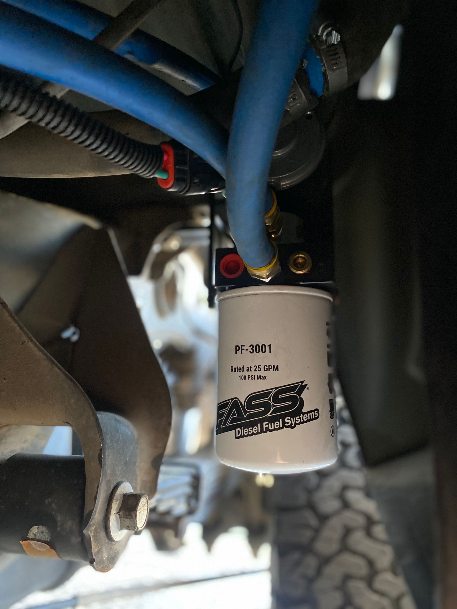 A close up of a fuel filter on a vehicle