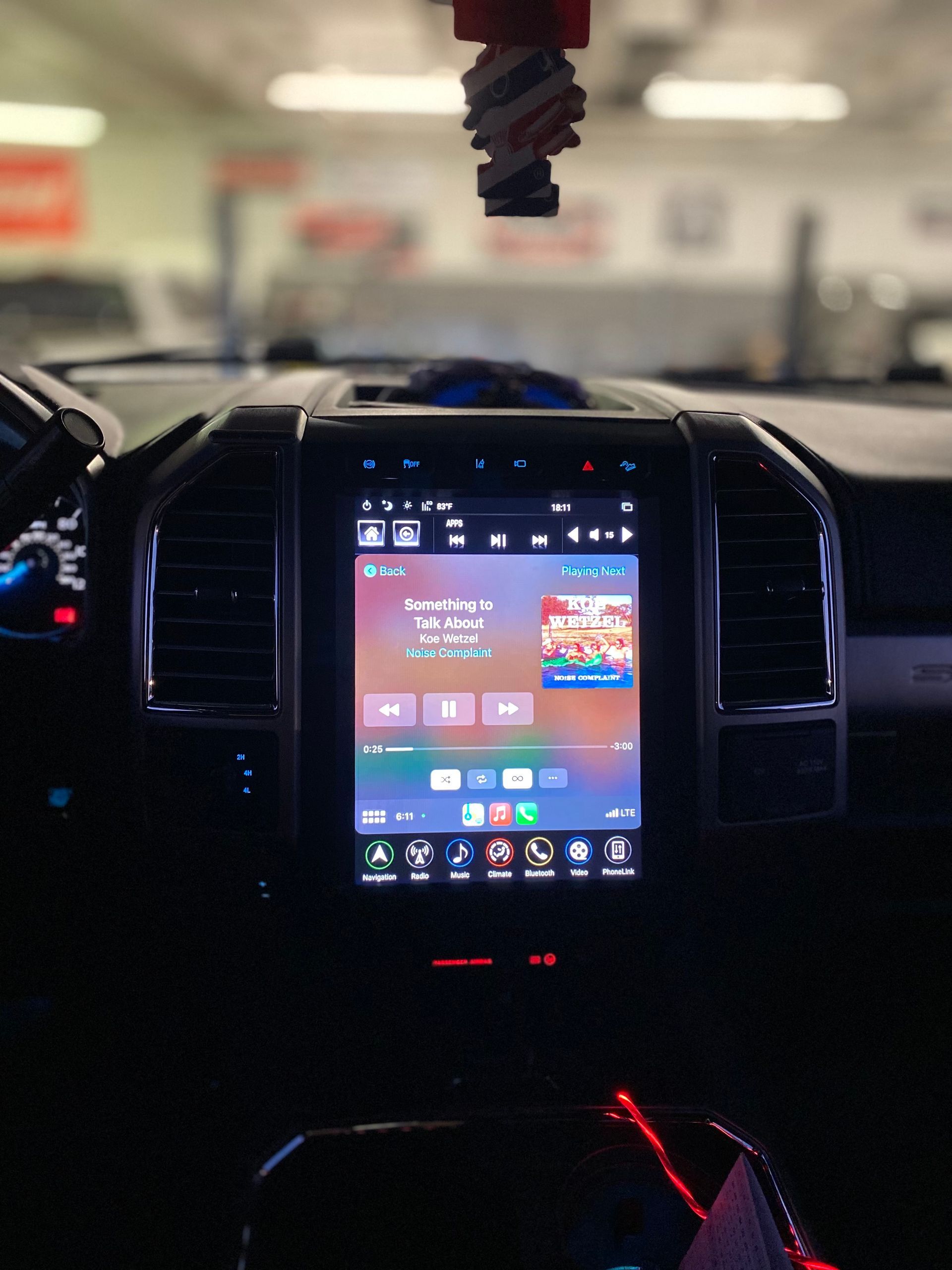 A car dashboard with a screen that says ' ipod ' on it