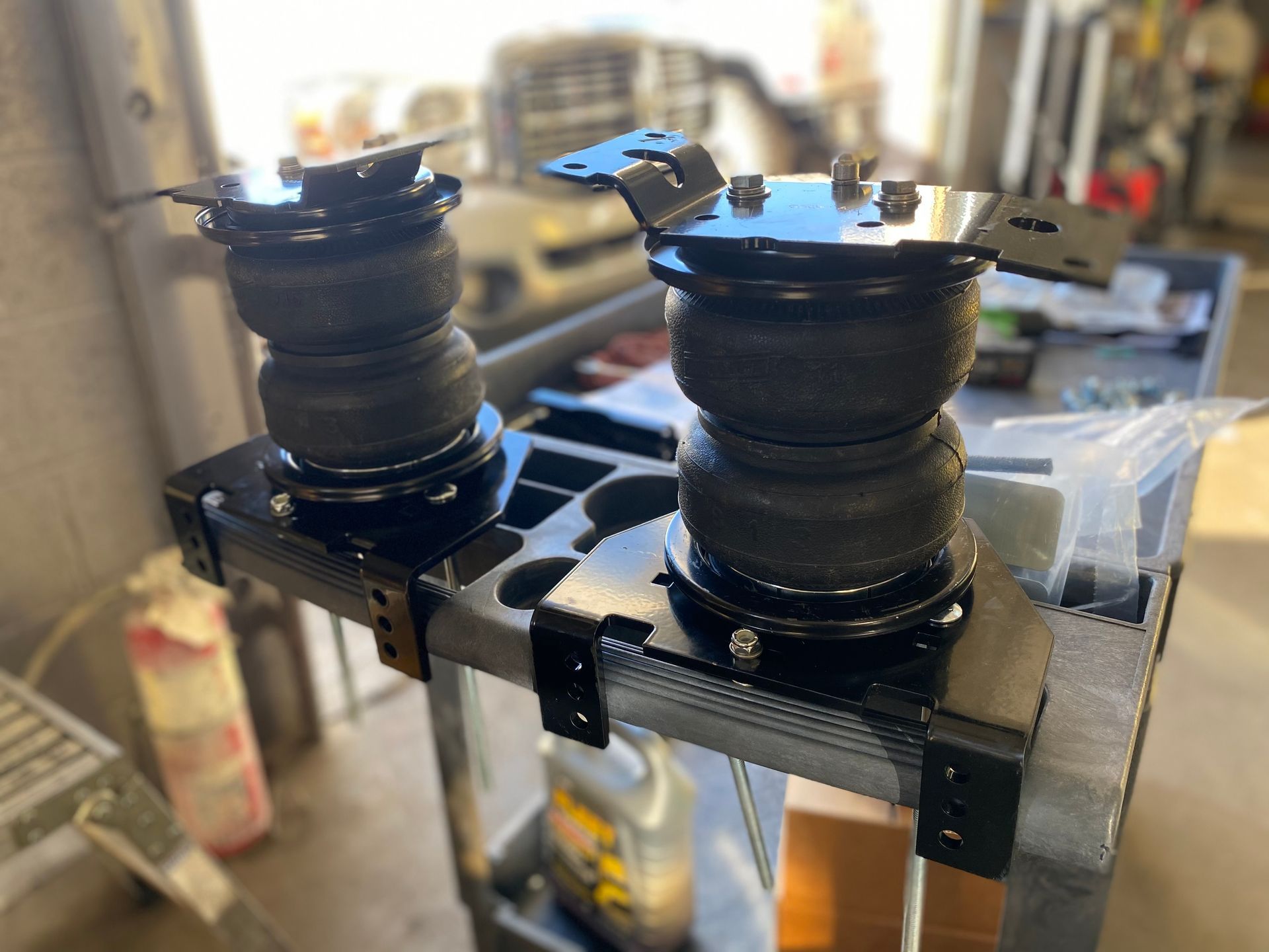 A pair of air bags sitting on top of a metal shelf.