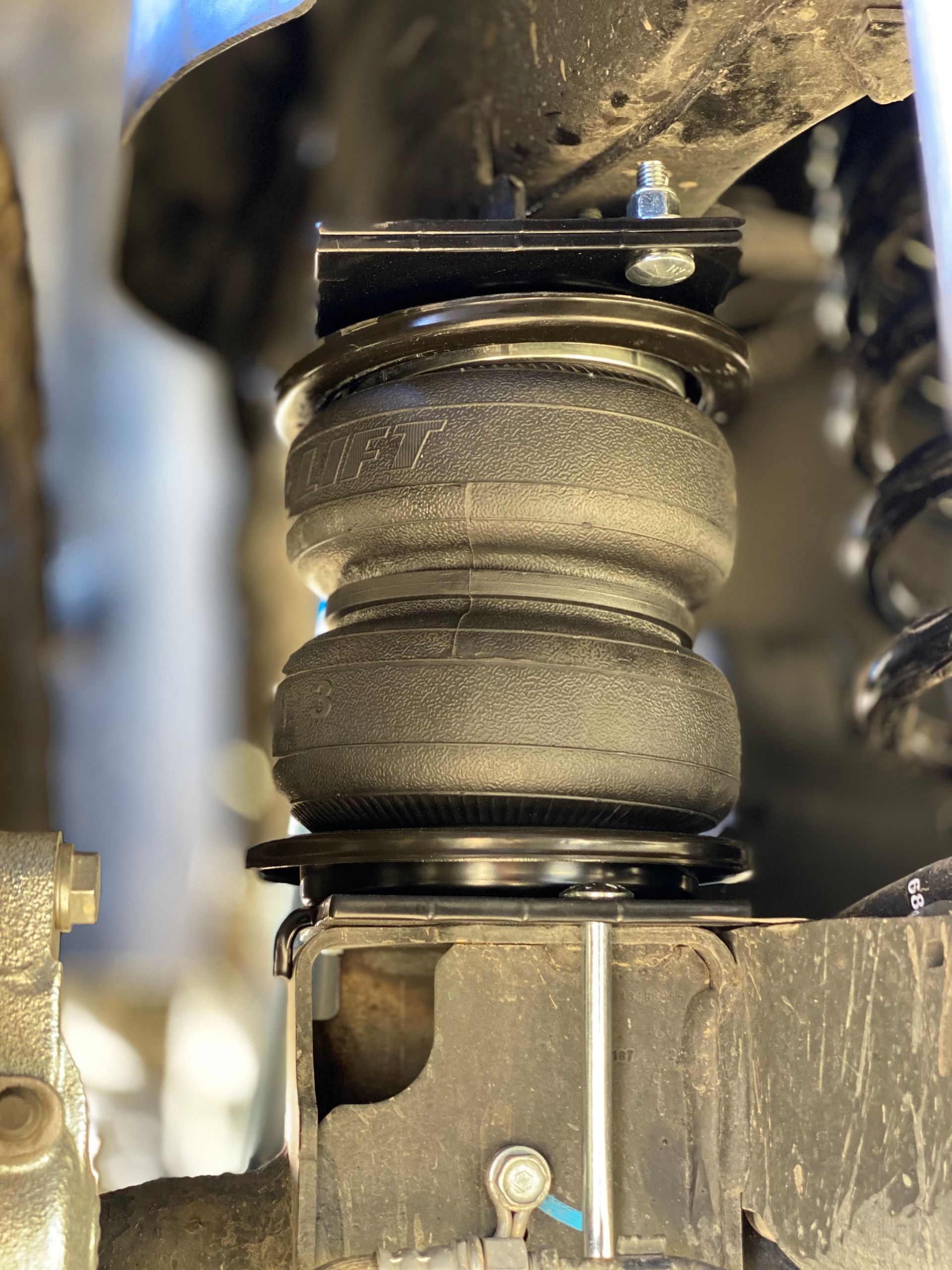 A close up of a suspension system on a car.