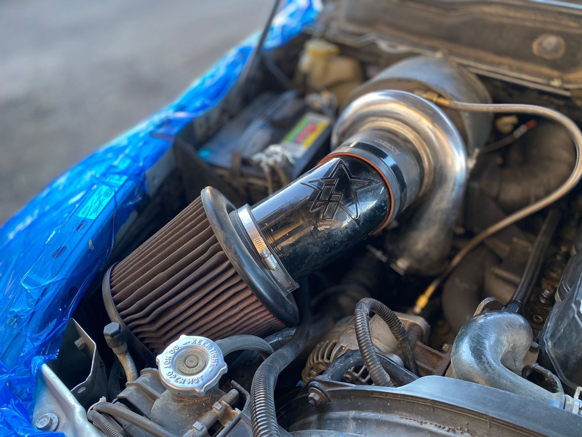 A close up of a car engine with a filter in it.
