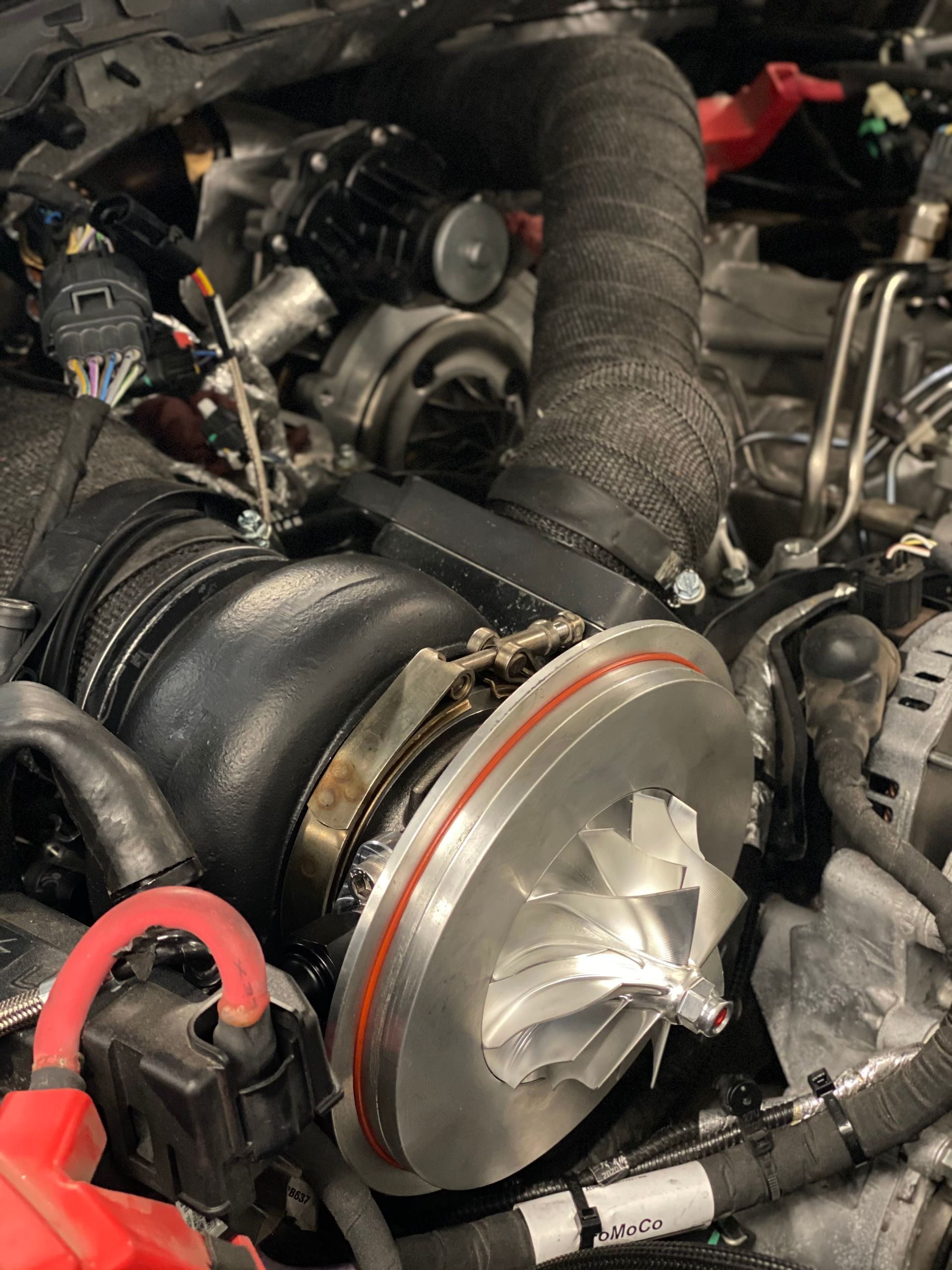 A close up of a turbocharger in a car engine
