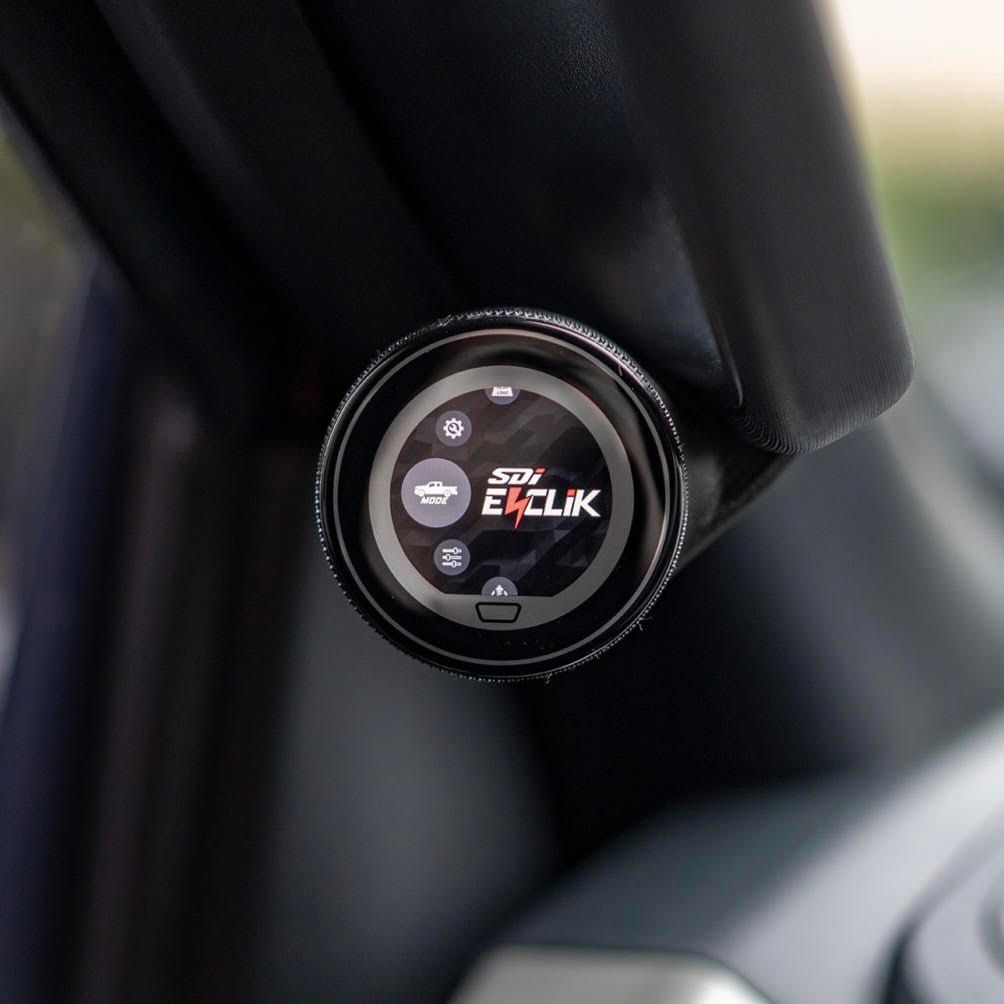 A close up of a device in a car that says eclik