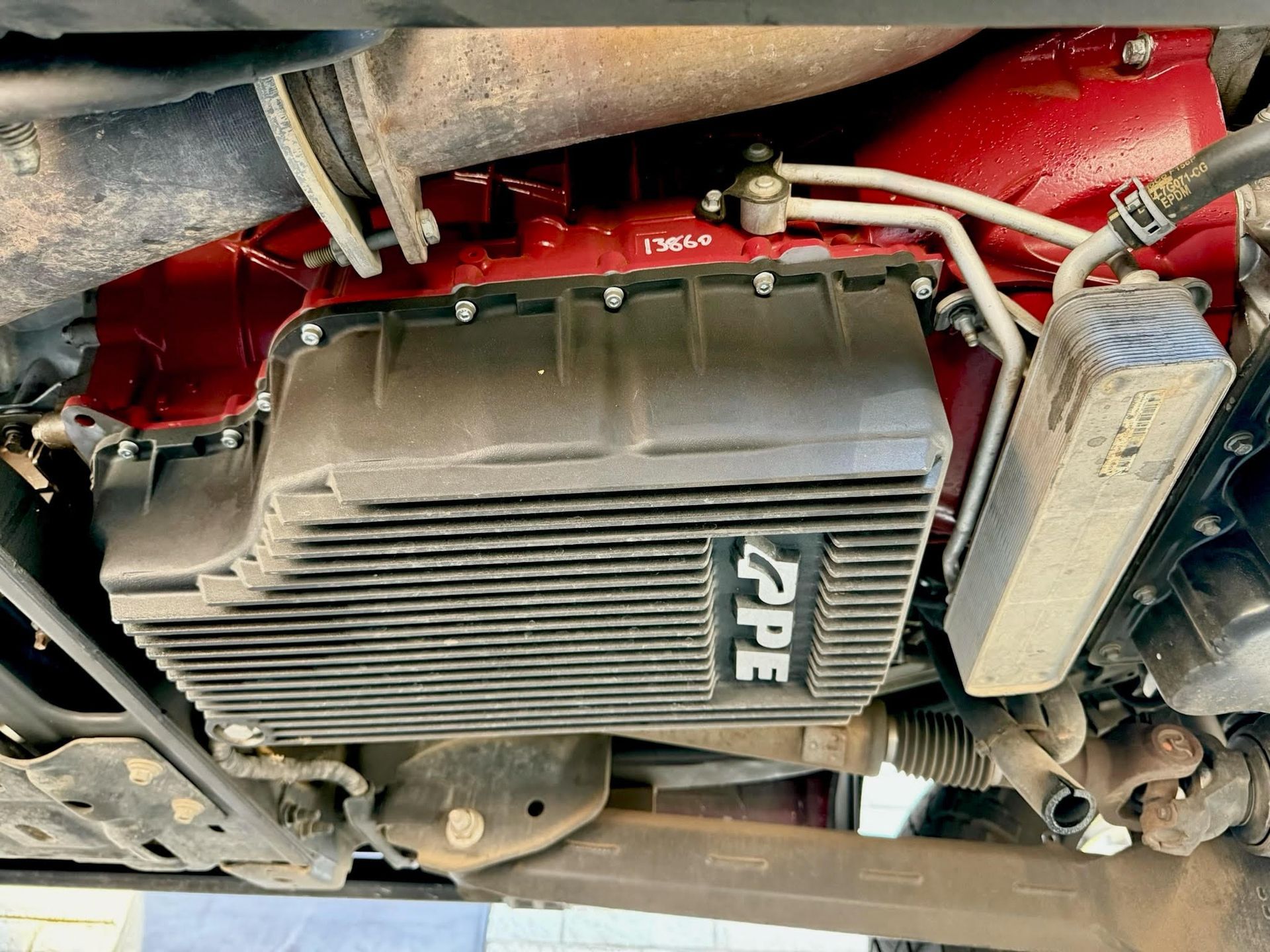 A close up of the underside of a car engine