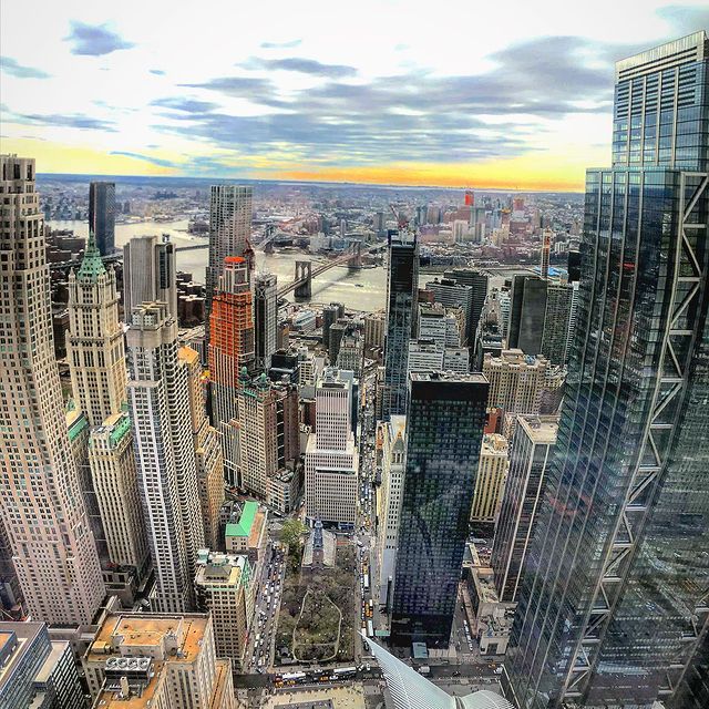 An aerial view of a city with lots of tall buildings