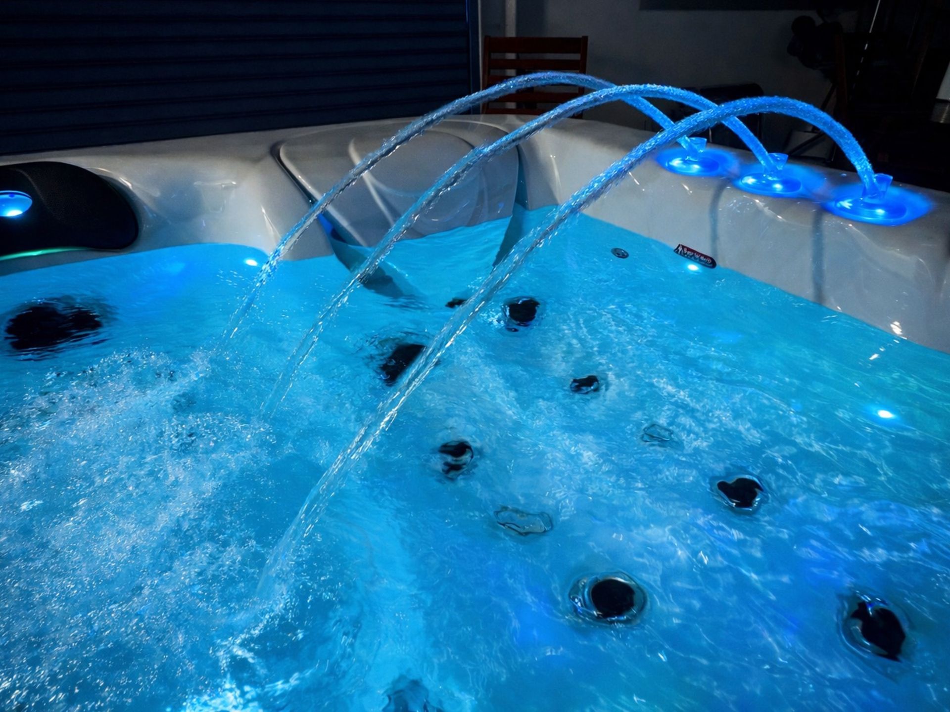Outdoor hot tub featuring triple fountain water system with blue LED lighting, enhancing hydrotherapy relaxation and luxury spa experience for home and resort installations in Thailand
