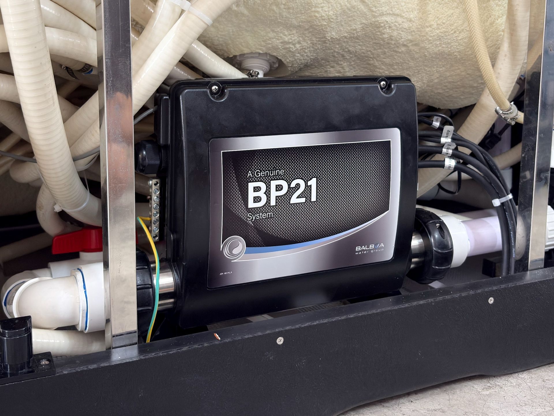 Balboa BP21 spa control pack installed inside hot tub cabinet controlling pump, heater and hydrotherapy system