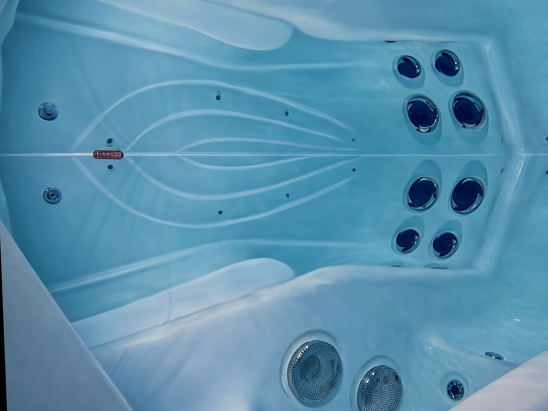 Interior view of hot tub featuring ozonator system that helps sanitize spa water, eliminate bacteria, and maintain crystal-clear water quality for outdoor hot tubs and jacuzzis in Thailand