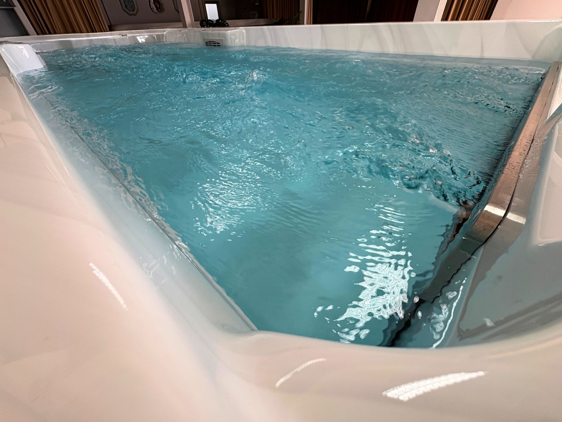 Smooth water flow inside above-ground swim spa, powerful counter current for swimming exercise, reinforced acrylic fiberglass structure for strength and durability