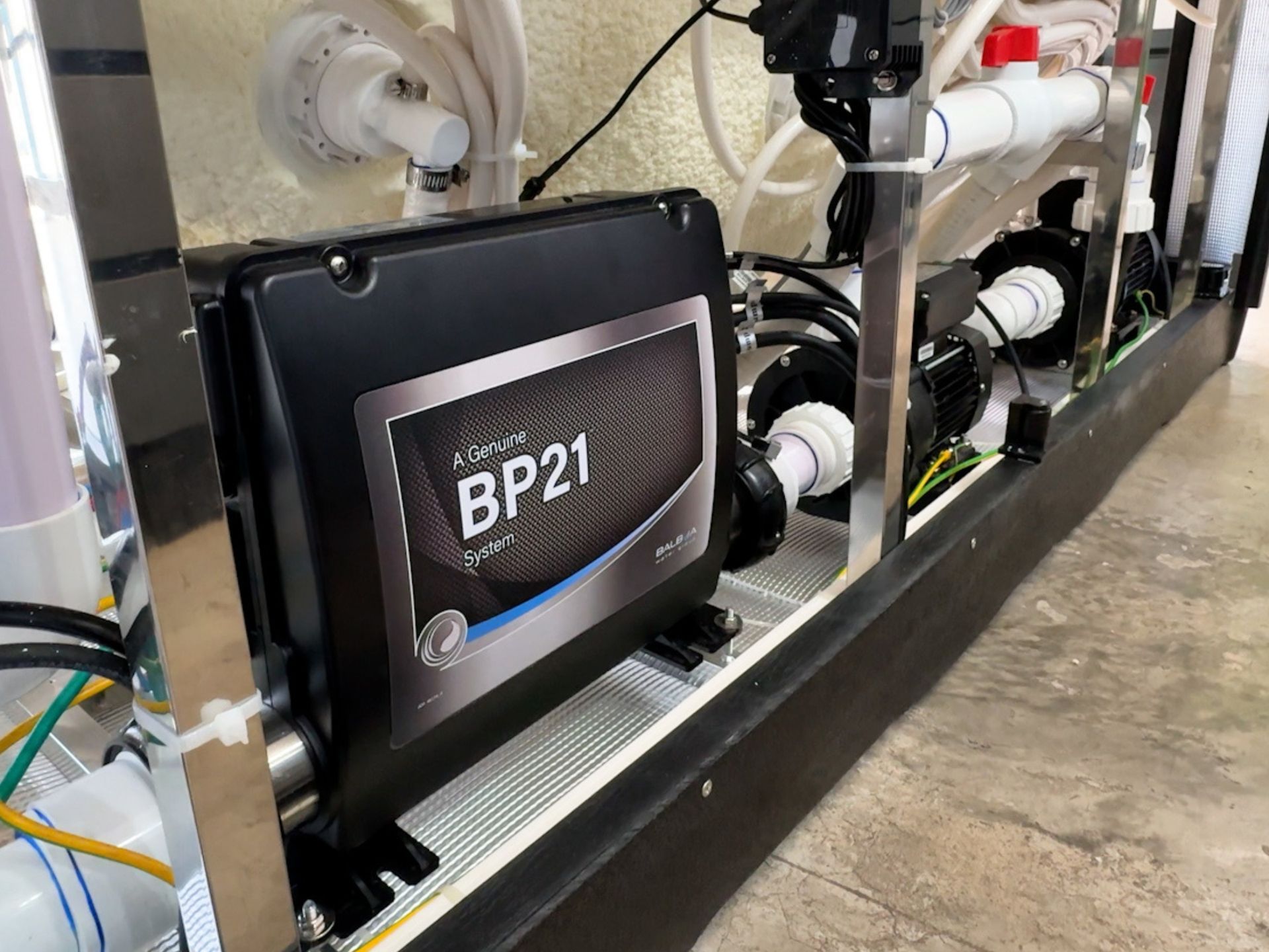 Image of a USA-made hot tub control system circuit board installed inside the spa structure, showing the main control unit and pump system. Designed for precise temperature control, hydrotherapy jet operation, and overall system management, meeting international quality standards for residential homes, villas, and resort spa installations in Thailand.