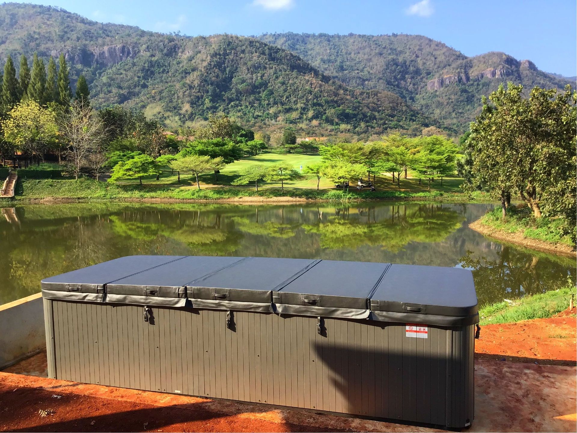 Swim spa fully covered with insulated hard cover for heat retention, built on a corrosion-resistant galvanized steel frame.