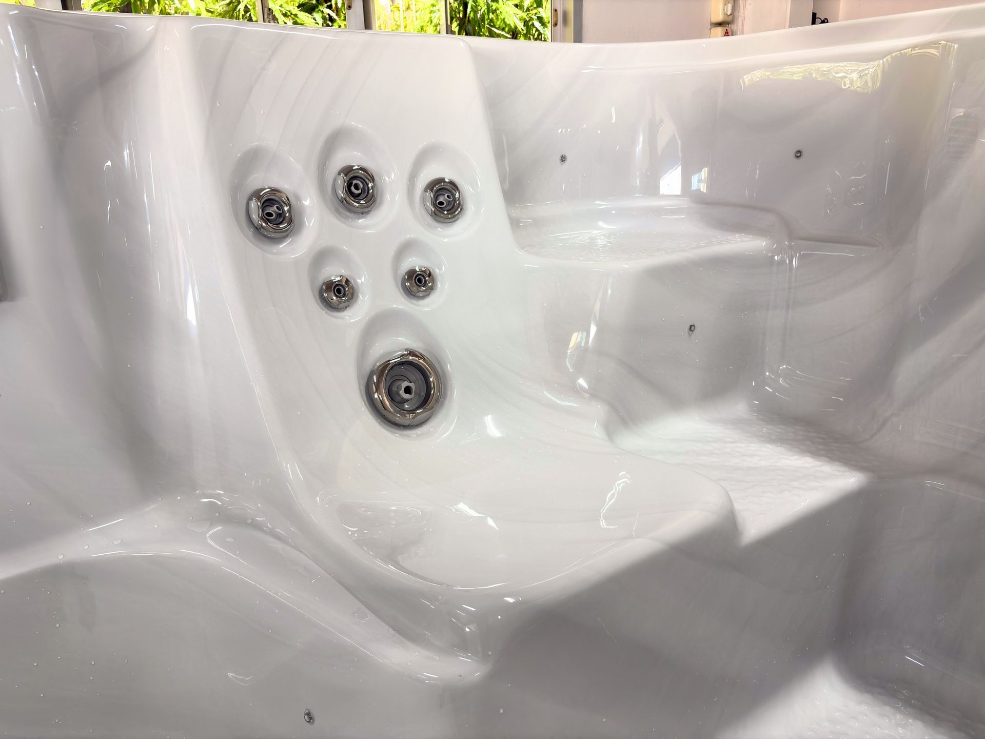 Ergonomic seating design with integrated massage jets in Swim Spa Ultimate 16 for relaxation and therapy