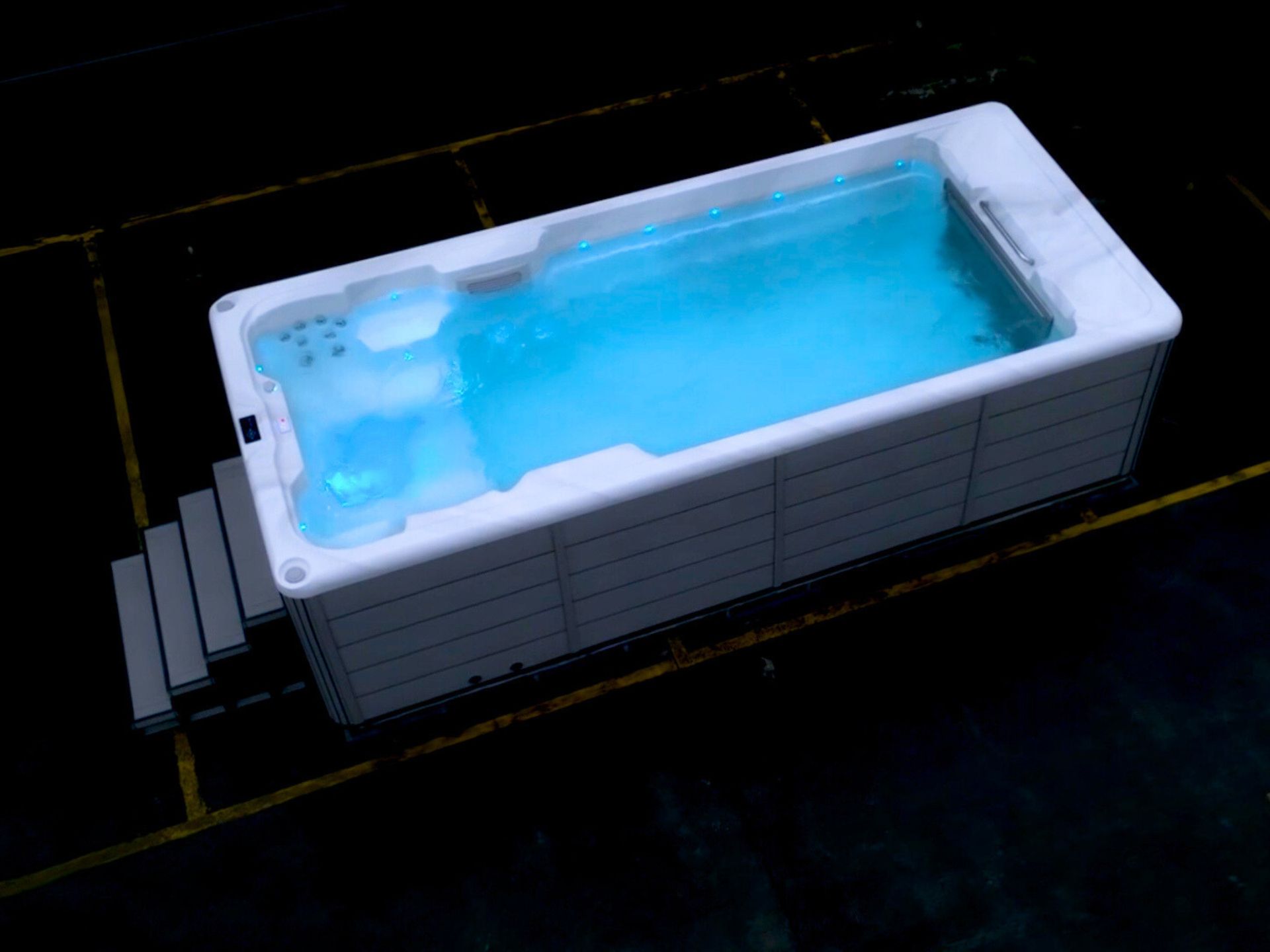 Hot tub touchscreen showing current water temperature and set temperature with control icons.