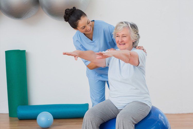 Extremity Practitioner — Senior Patient Exercising With With The Therapist in Modesto, CA