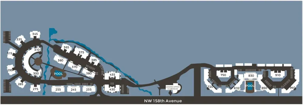 Floor plan of a building with a circular structure and several wings, likely a resort or campus, with a waterway.