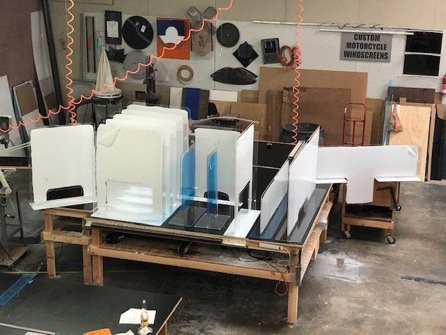 A warehouse with a sign that says caution motorcycle manufacturing