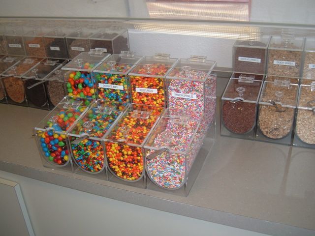 A display of candy including m & m 's and sprinkles