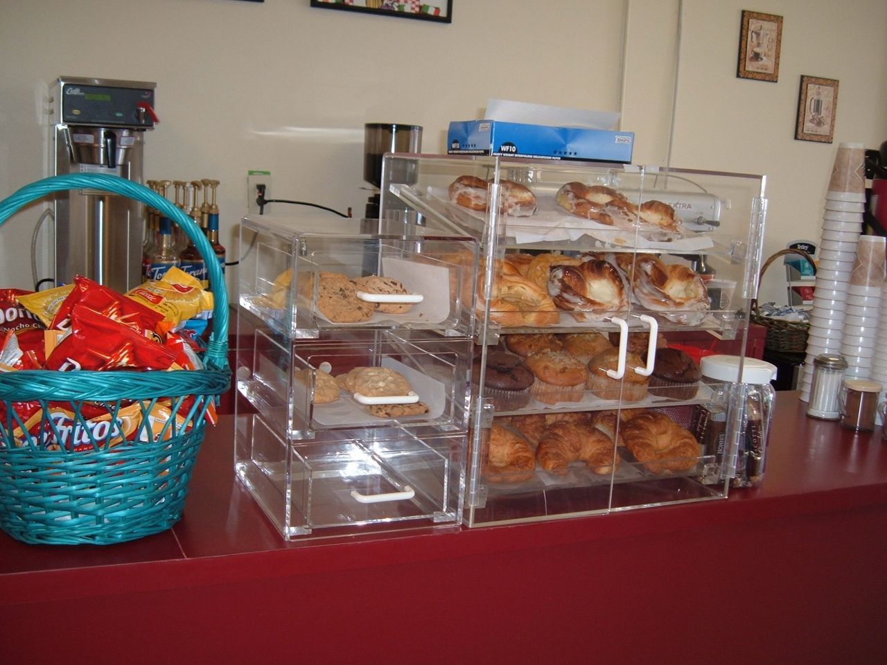 A basket of twizzlers sits next to a display of pastries