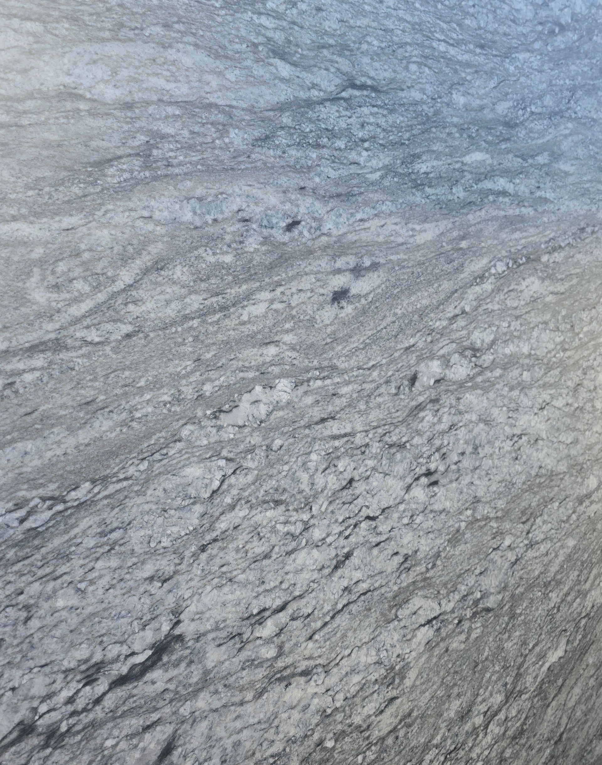 A close up of a gray marble counter top.