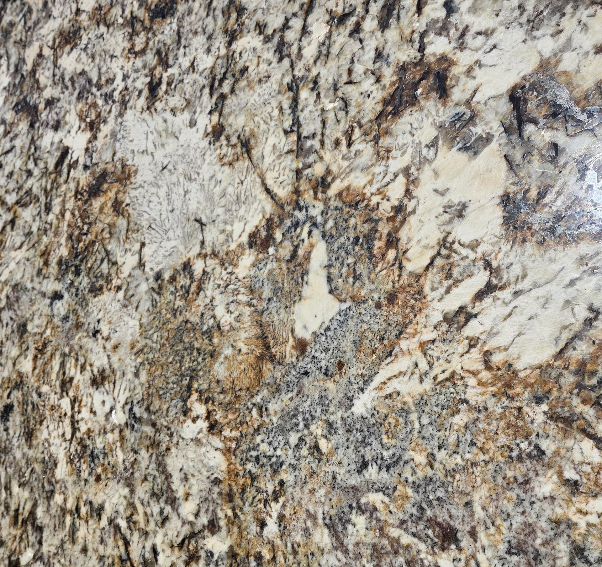 A close up of a brown and white granite counter top