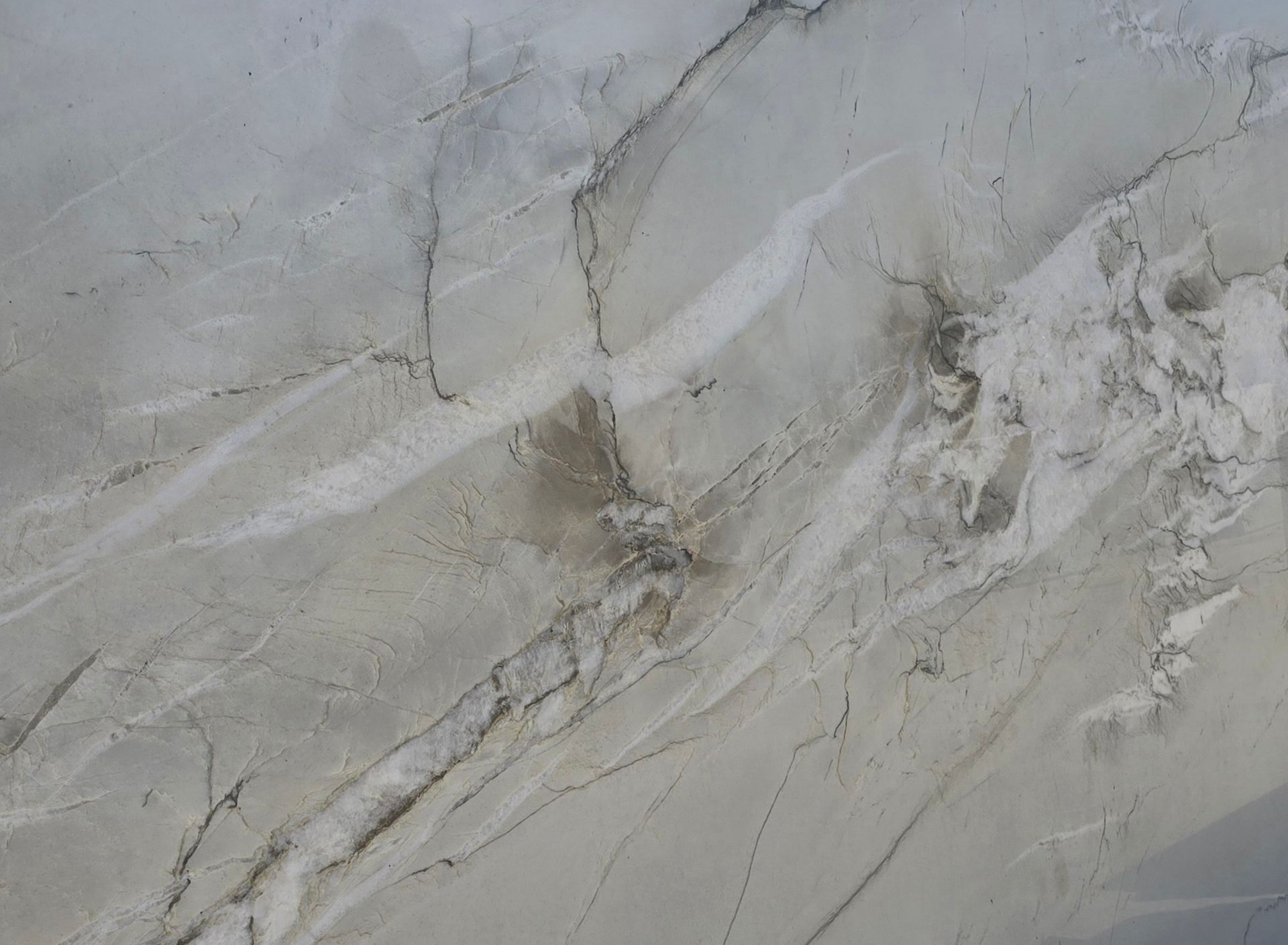A close up of a white marble counter top.
