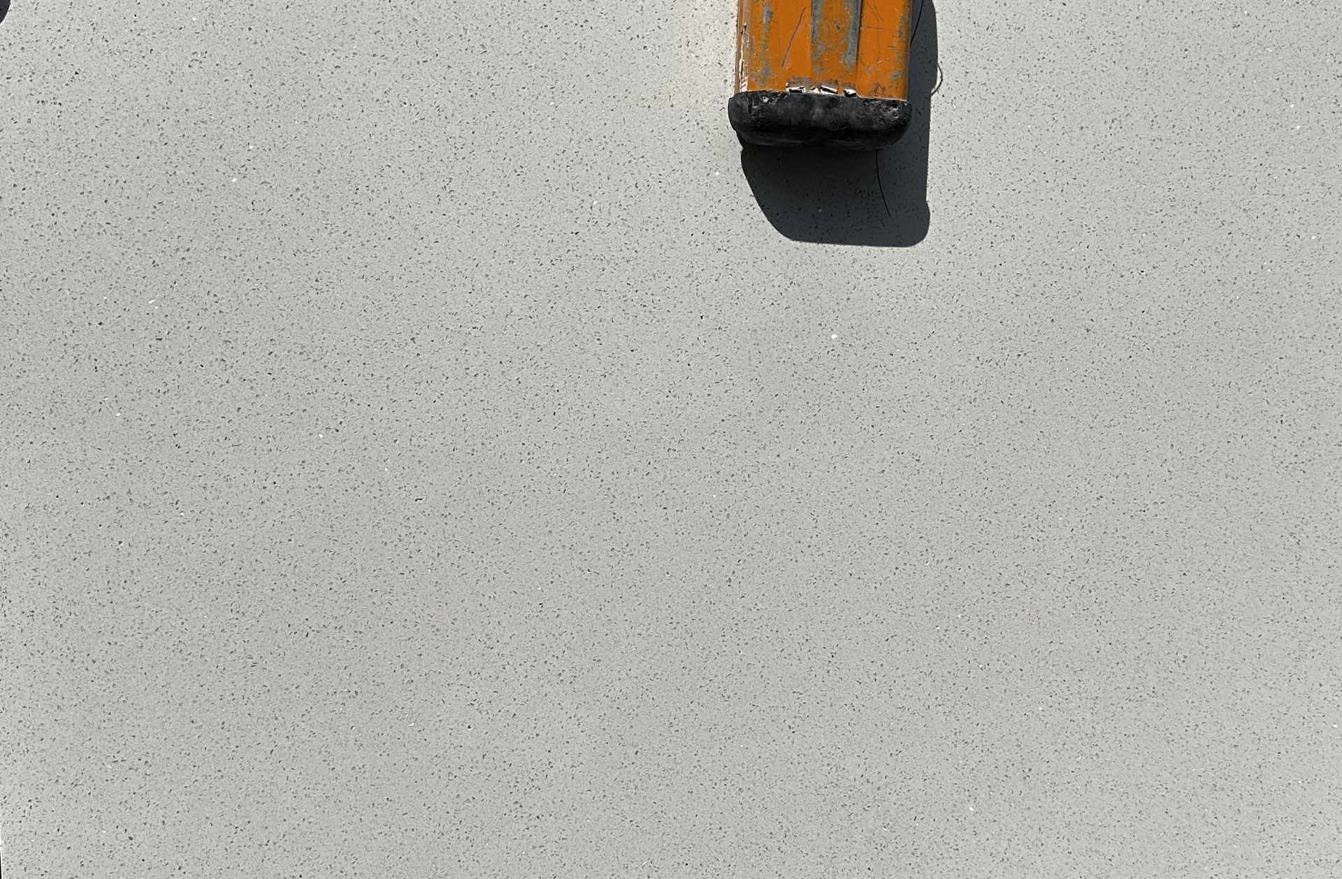 A piece of wood is sitting on a white surface