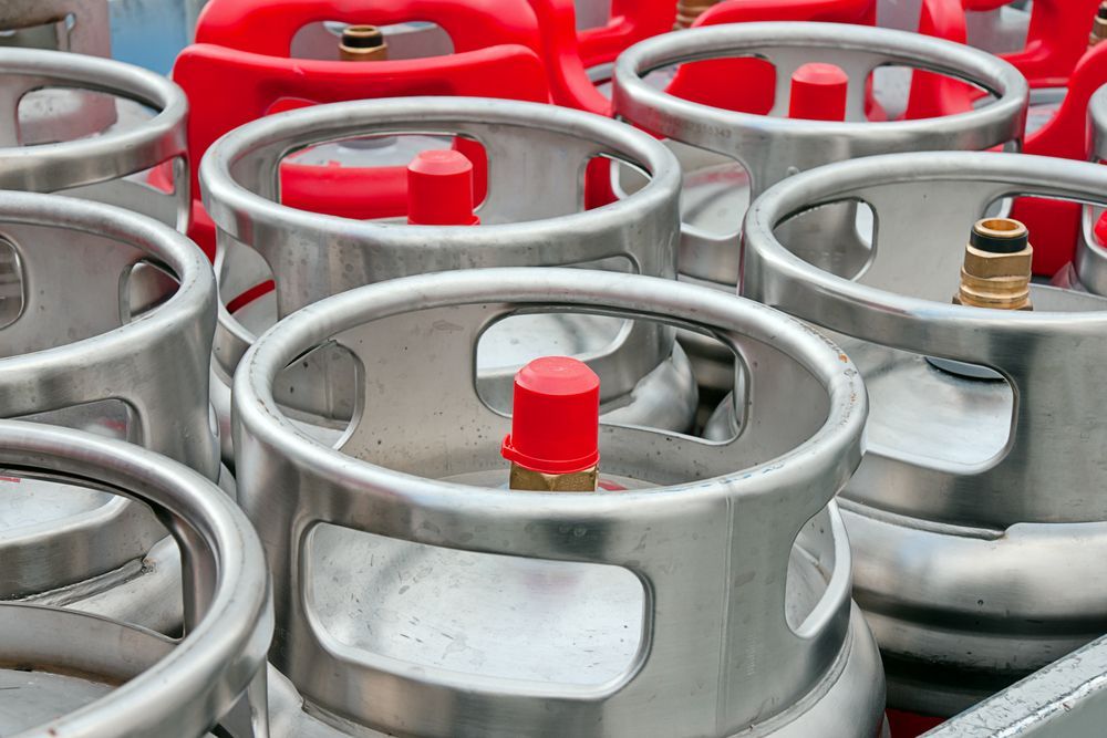 Rows of Silver Metal Gas Cylinders — Kuranda Gas & Supplies In Cow Bay, QLD