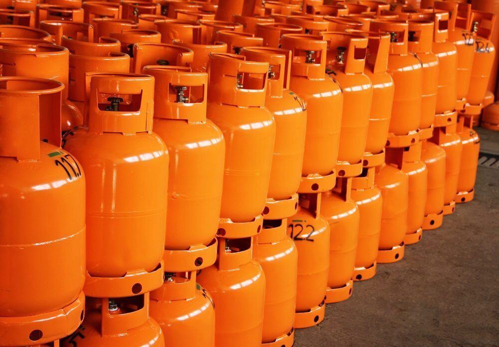 Orange Propane Tanks Stacked, Possibly in A Warehouse — Kuranda Gas & Supplies In Cairns, QLD
