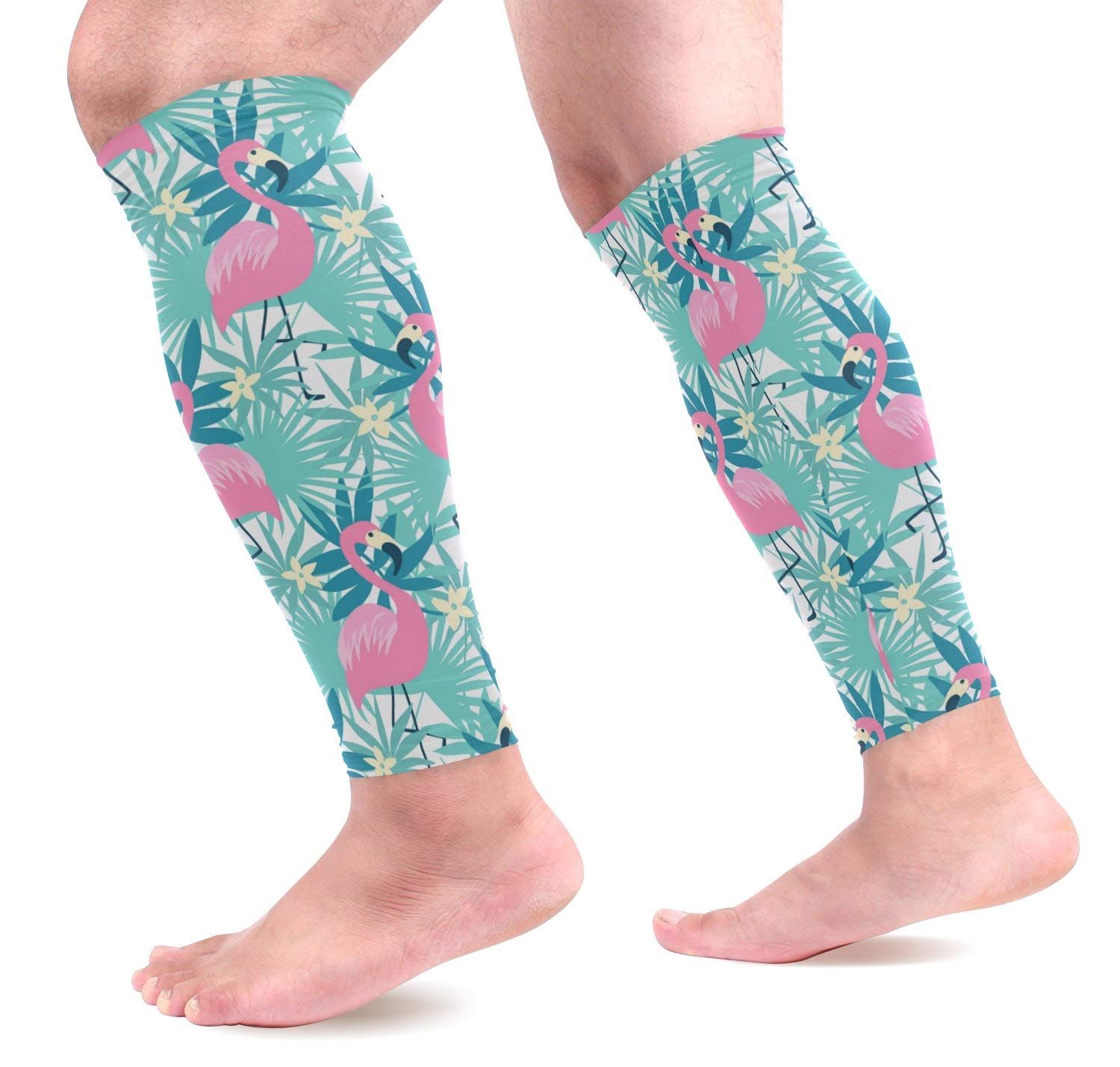 a pair of leg warmers with flamingos and flowers on them